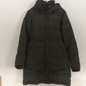 Winter woman’s coat kitchen orange